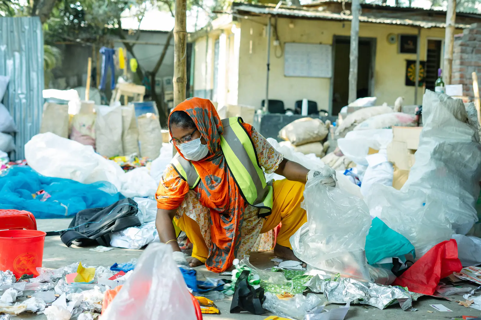 A waste worker sorting recovered materials